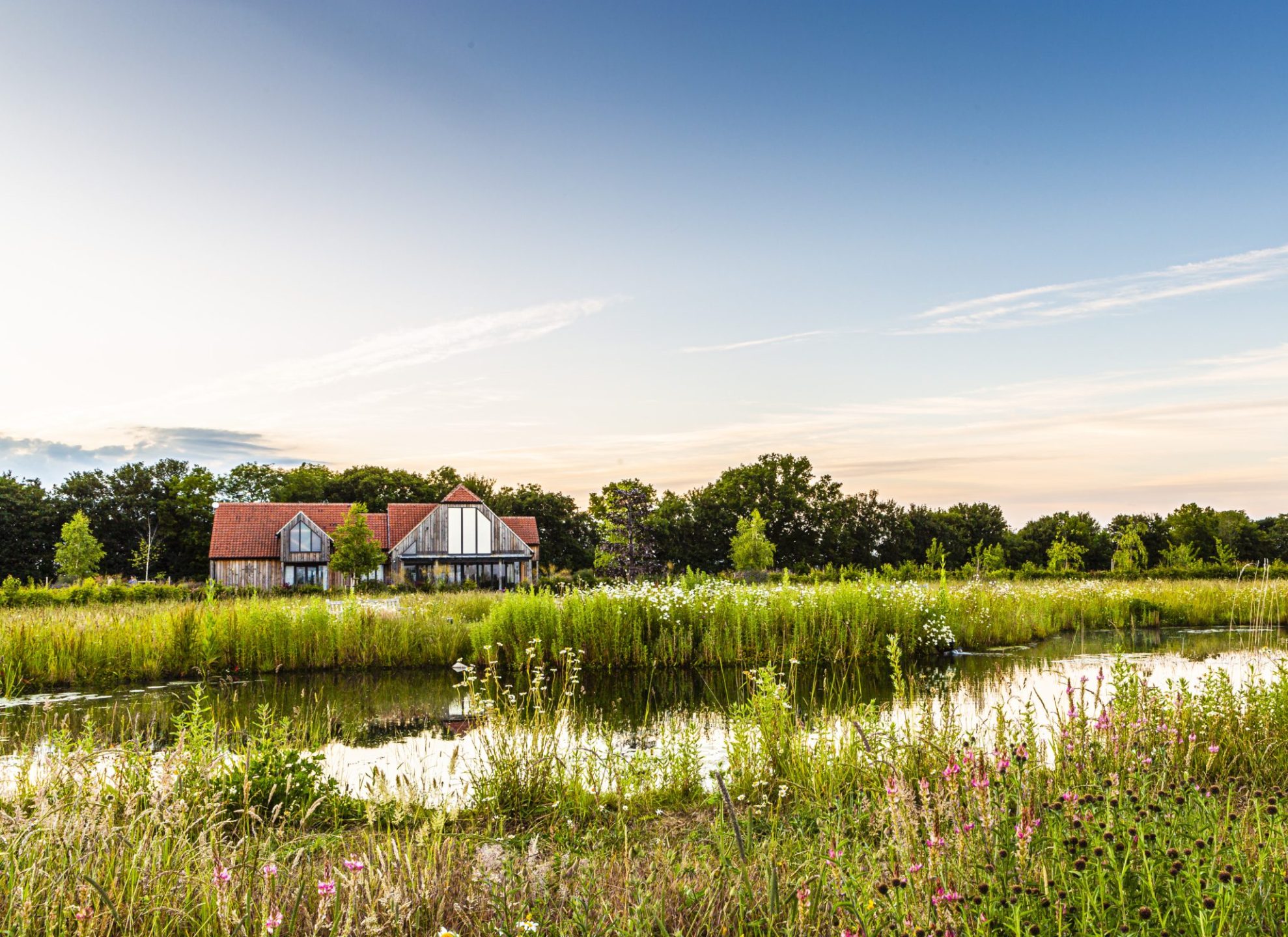 OPM Natural Burial Ground - View of Pond-Lodge in Background